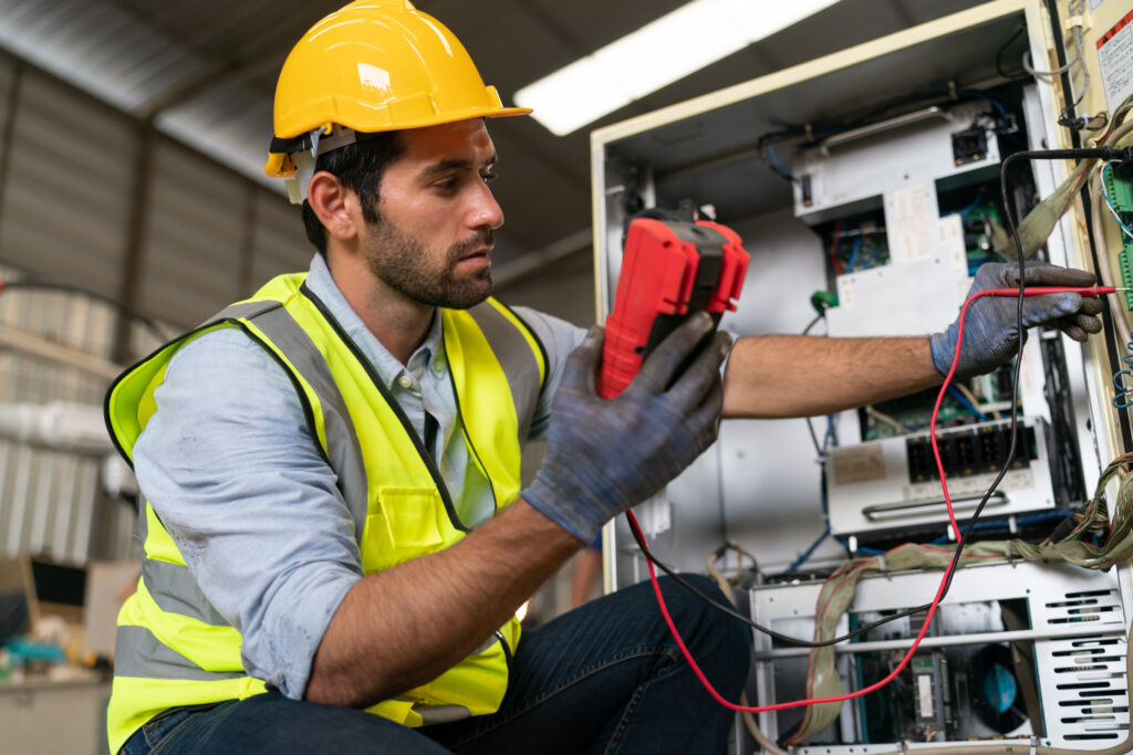 engineer working on maintenance of modern arm in factory warehouse